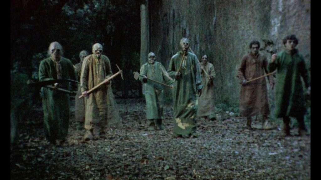 burial ground zombies coming towards the camera horror movie